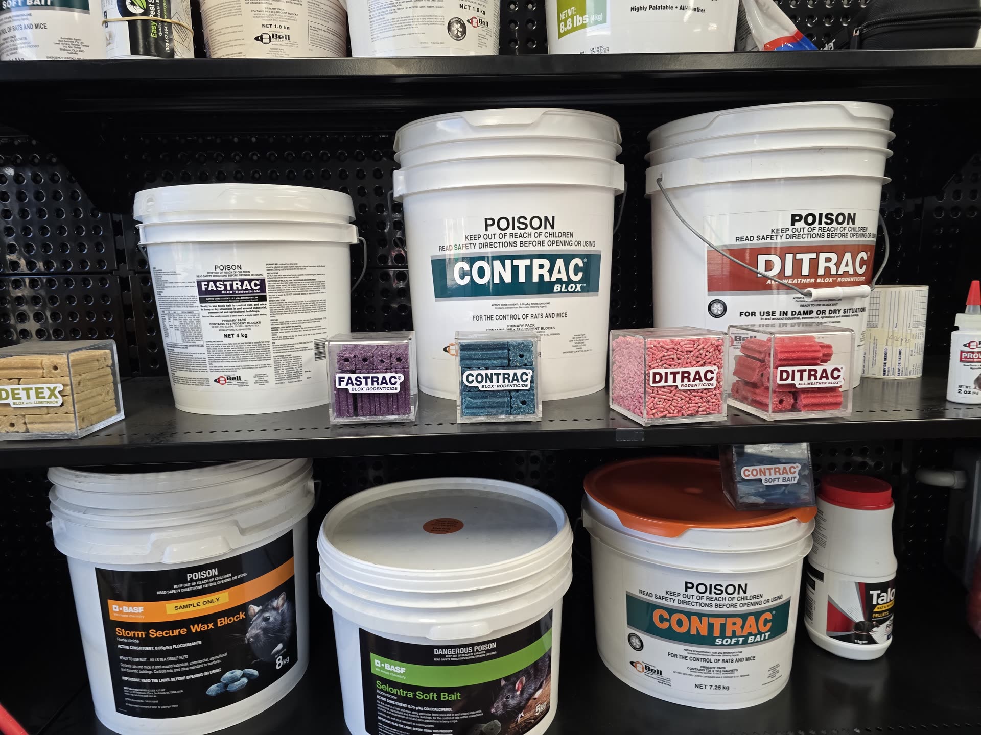 Two-tier shelf with Fastrac, Contrac, Ditrac, Storm and Selontra rodenticides